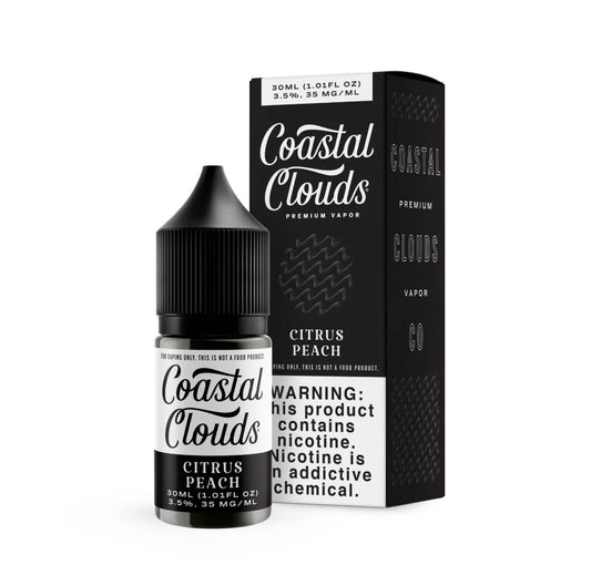 Coastal Clouds Mango vape juice bottle and packaging on a white background